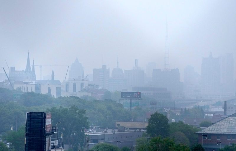 A Milwaukee skyline is surrounded in a haze from Canada’s wildfire smoke on Wednesday, June 28, 2023. The quality of Wisconsin's unhealthy air continues from Canadian wildfires.