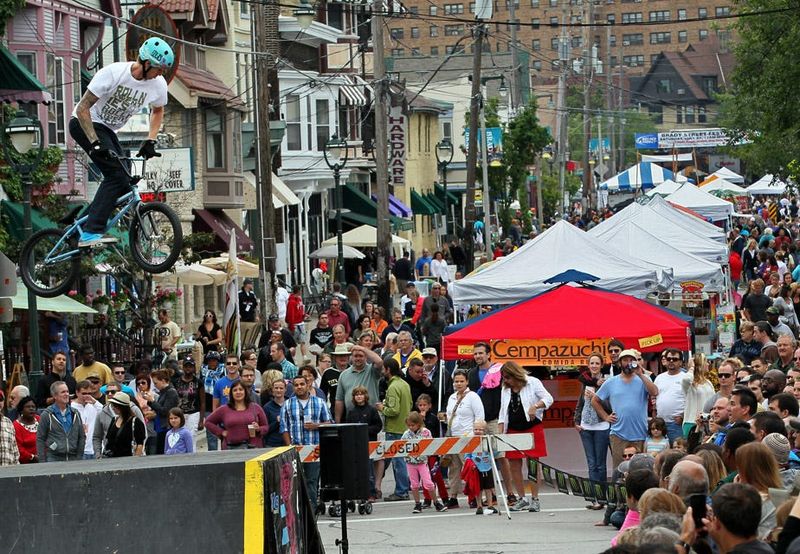 Freestyle BMX riders wow the crowd during the Brady Street Festival in 2013.