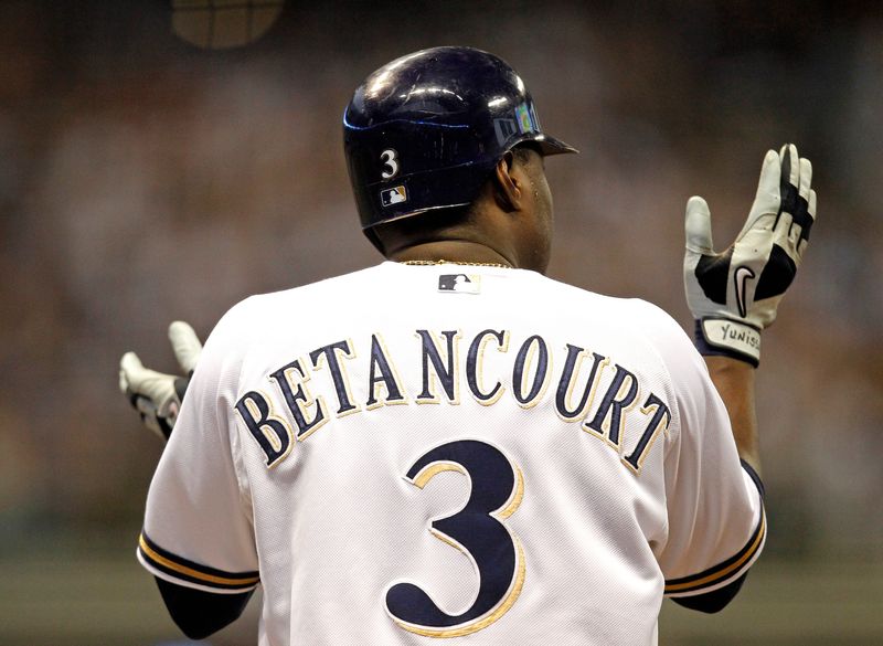 Yuniesky Betancourt applauds the lead after his RBI single in the 6th of Game 5 of the NLDS in 2011.
