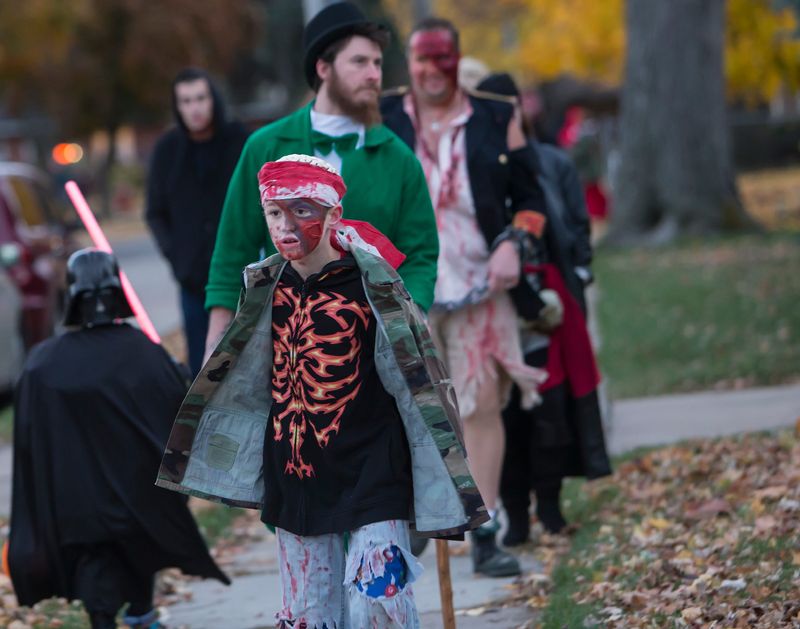 Augie Schimke trick or treats on Halloween night with his family also dressed in costumes. File photo from 2014.