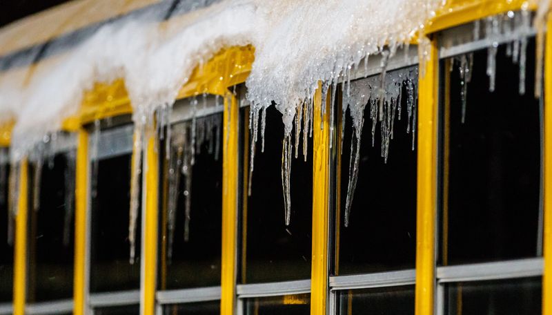 Icicles hanging from a school bus foretell a cold and blustery night ahead for the WIAA Division 1 Level 4 playoff game between Marquette and Muskego in Hartland on Friday, Nov. 9, 2018.