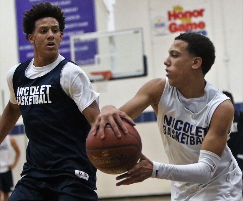 Brothers Jalen (left) and Kobe Johnson of Nicolet compete during a drill at practice on November 19.