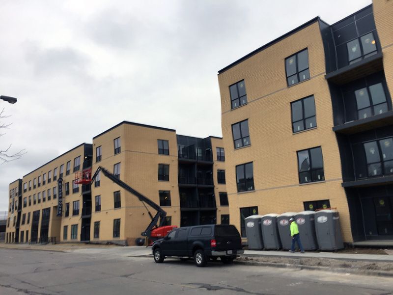 River House apartments, shown finishing construction in 2017, has been sold to a Seattle-area firm for $58 million.