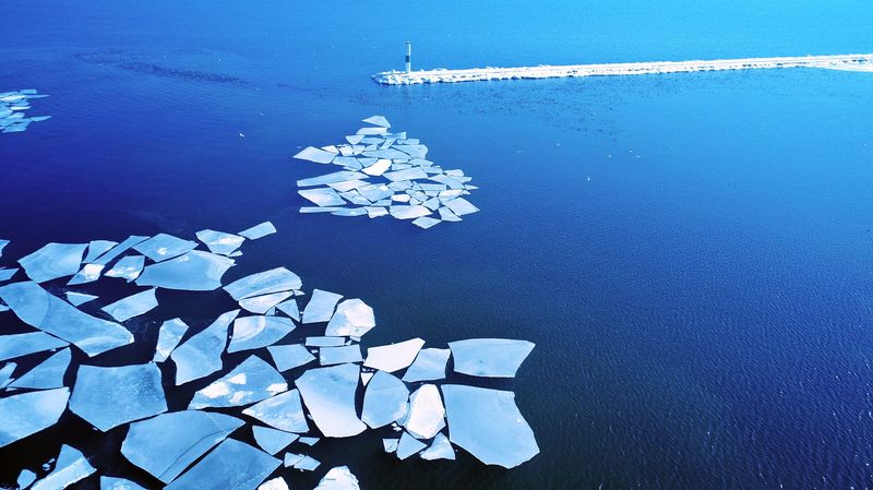Sheets of ice float on Lake Michigan just inside the breakwater near the Milwaukee Community Sailing Center in Veterans Park Feb. 14, 2018.