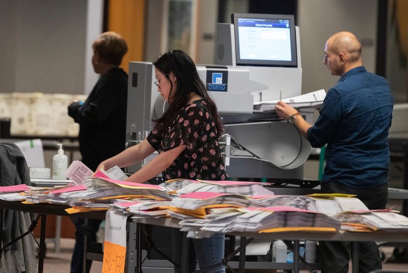 City of Milwaukee Election Commission workers process absentee ballots Tuesday, April 7, 2020 in downtown Milwaukee, Wis. As of Tuesday, more than 860,000 absentee ballots have already been returned to Wisconsin election clerks. 



MARK HOFFMAN/MILWAUKEE JOURNAL SENTINEL