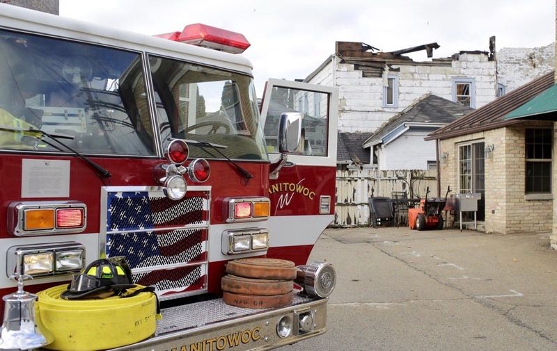 FILE - Firefighters on the scene of an apartment fire in the 700 block of Franklin Street in Manitowoc Dec. 4, 2020.