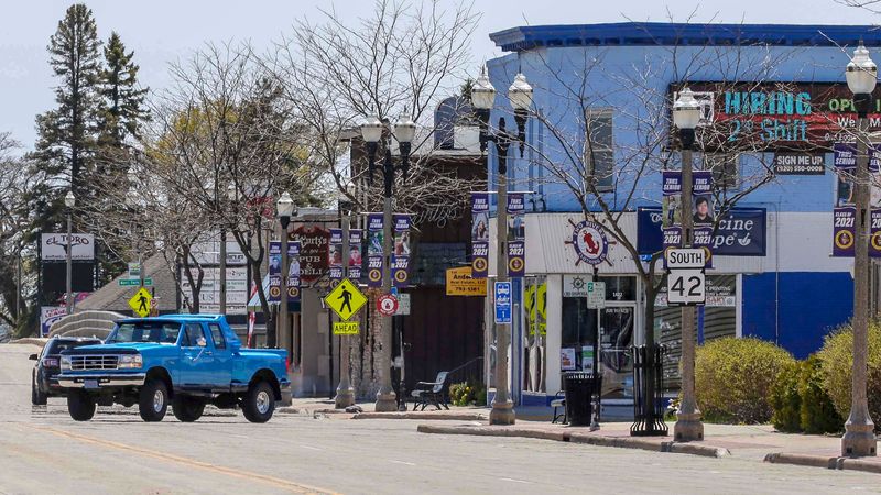 A vehicle turns out northbound onto Washington St. in downtown near the Two Rivers Clothing Company, Saturday, May 8, 2021, in Two Rivers, Wis.