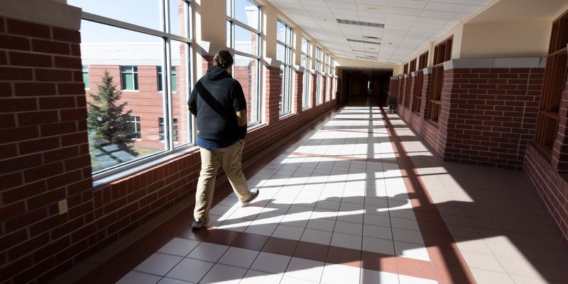 A student walks the halls of Fond du Lac High School in 2020.