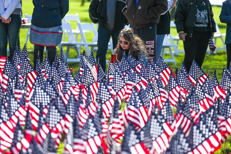 Allison A. takes a picture of a Field of Flags.