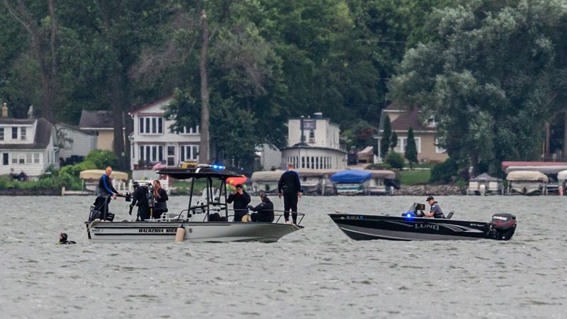 Members of the Waukesha County Sheriff's Department Dive Team resume searching Pewaukee Lake Sunday morning, July 19, for a 22-year-old man who disappeared while swimming July 18.