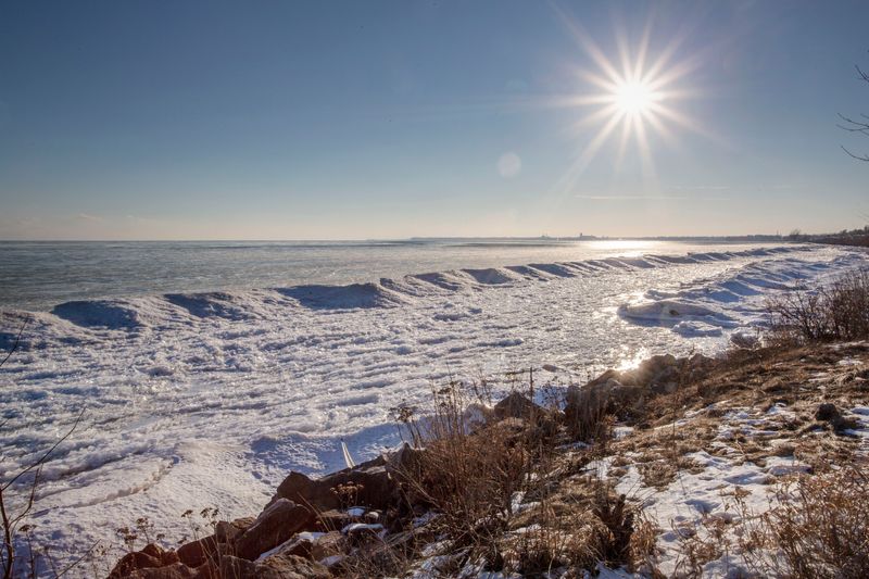 The sun highlights the icy textures of the lakefront near the Mariners Trail in Manitowoc, as seen Friday, Jan. 21, 2022.