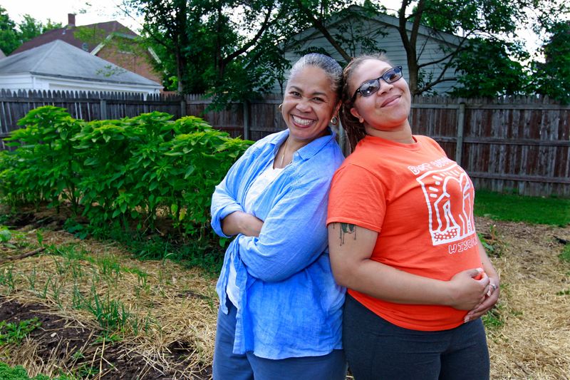 Angela Moragne, left and her daughter Stevey Pitts are shown in front of their callaloo plants in 2016 at  their microfarm in Milwaukee. They are the creators of That Salsa Lady.