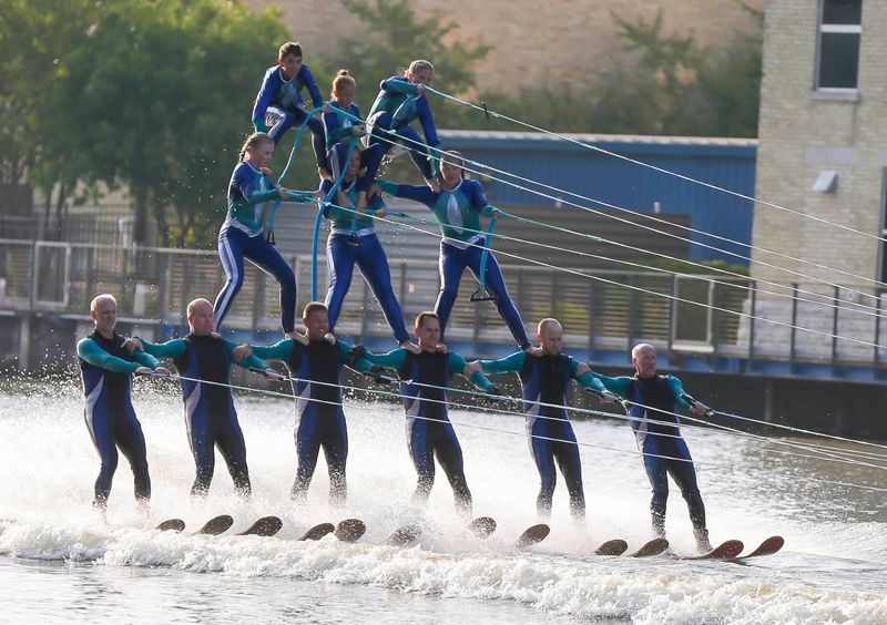 The Webfooters from Fremont, Wis., ski in a pyramid on the Manitowoc River during Lakeshore Balloon Glow, Friday, August 18, 2023, in Manitowoc, Wis.