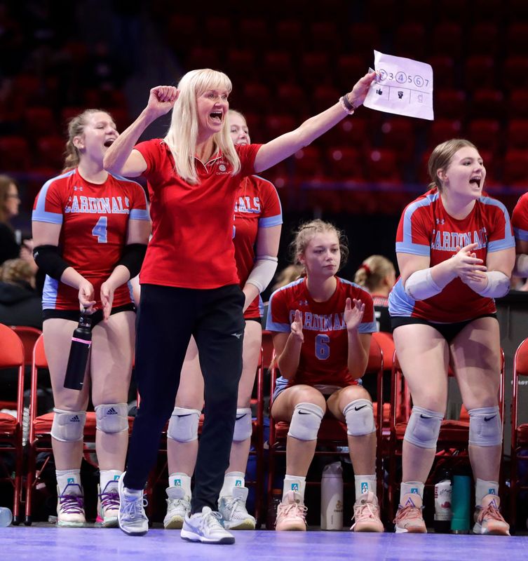 Newman Catholic Head Coach Betty Lange celebrates a point during the final set of the team's WIAA Division 4 girls volleyball state semifinal against Prentice High School on Nov. 3, 2023, at the Resch Center in Ashwaubenon, Wis.