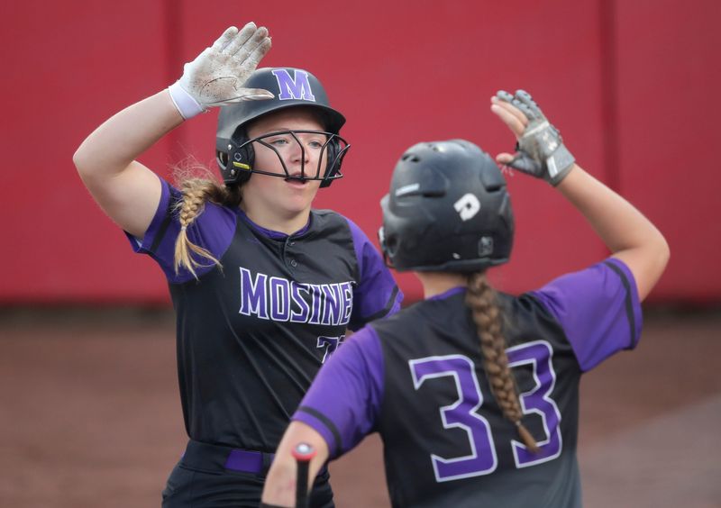 Mosinee High School's Taelyn Jirschele (23) celebrates scoring a run with Alanna Bembenek (33) against Waupun High School during their WIAA Division 2 championship softball game Saturday, June 08, 2024, at the Goodman Softball Complex in Madison, Wisconsin.