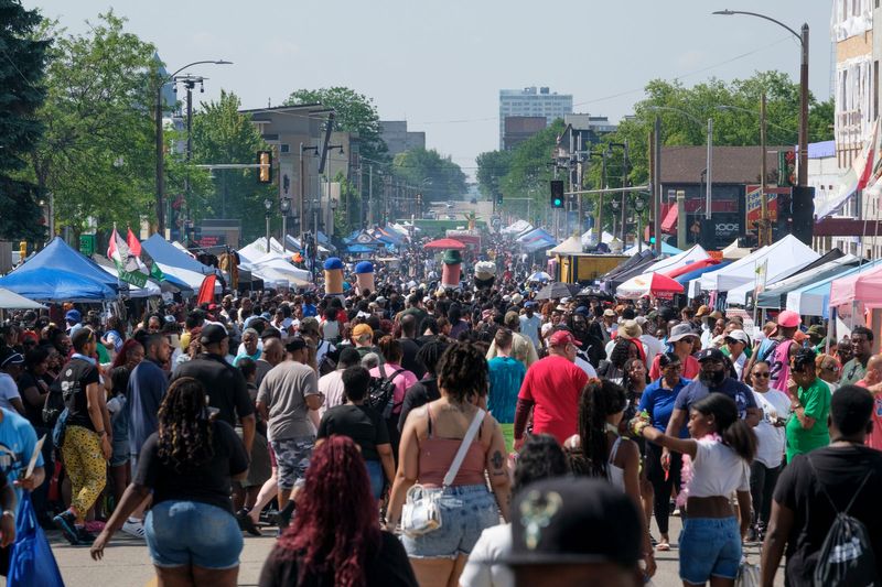 The public walks around Martin Luther King, Jr. Drive for the 2024 Juneteenth Parade in Milwaukee on Wednesday, June 19, 2024.