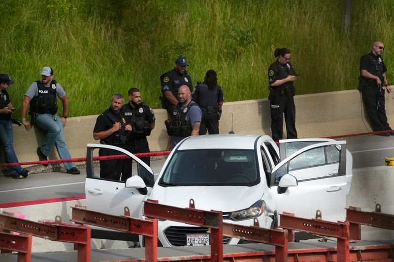 Police investigate a vehicle after all northbound and southbound lanes on Interstate 43 from Capitol Drive to Locust Street were closed due to a police investigation in Milwaukee on Thursday, June 20, 2024.