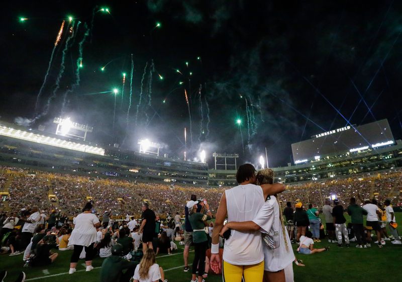 Green Bay Packers quarterback Jordan Love and his fiancée Ronika Stone watch a fireworks show during Family Night on Saturday, Aug. 3, 2024, at Lambeau Field in Green Bay, Wis.