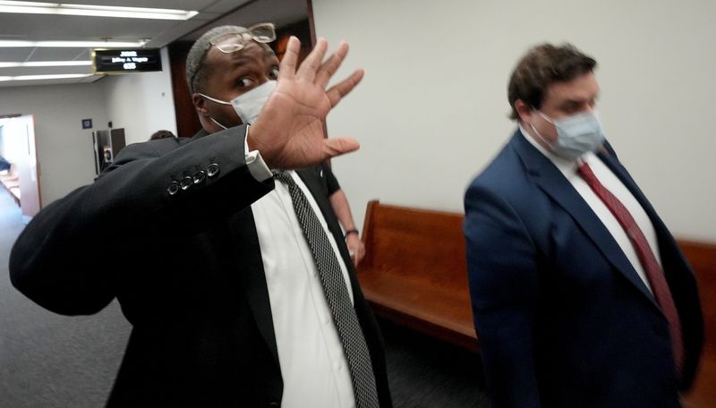 Jimmy D. Davis Jr.. left, leaves court Thursday, June 2, 2022 at the Milwaukee County Courthouse in Milwaukee. Last September, Davis was charged in Milwaukee County with embezzlement for pocketing about $15,000 from a customer's trust account and spent the money, the criminal complaint charges.