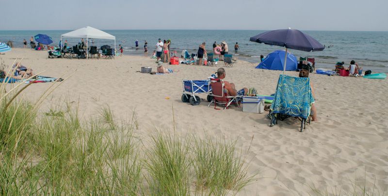 The beach at Kohler-Andrae State Park fills up with people on hot summer days, as seen in August 2024.