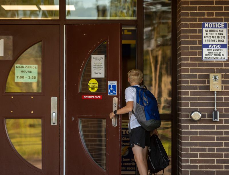Students of Ben Franklin Junior High fill up their lockers and find their way to their classes for their first day of school on Tuesday, September 3, 2024.