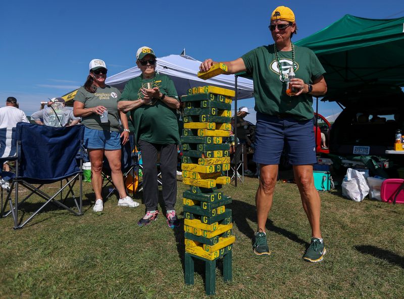 Carolyn Klecker plays tailgate jenga before a game between the Green Bay Packers and the Indianapolis Colts on Sunday, September 15, 2024, at Lambeau Field in Green Bay, Wis. 
Tork Mason/USA TODAY NETWORK-Wisconsin