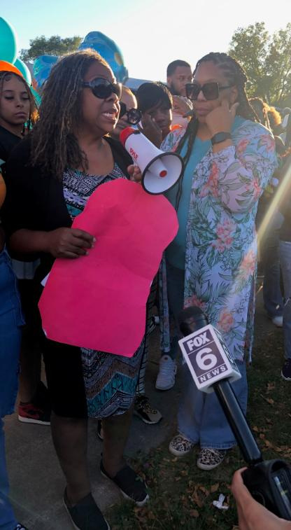 Martha Dunmore, left, says her daughter Talise's dreams were snatched from her by a hit-and-run driver. Martha Dunmore spoke on Sept. 28, 2024, at a Milwaukee vigil at North 76th Street and West Clinton Avenue, near where Talise, 20, was killed on Sept. 21.