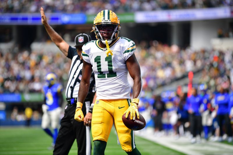 Oct 6, 2024; Inglewood, California, USA; Green Bay Packers wide receiver Jayden Reed (11) reacts after catching a pass against the Los Angeles Rams during the first half at SoFi Stadium. Mandatory Credit: Gary A. Vasquez-Imagn Images