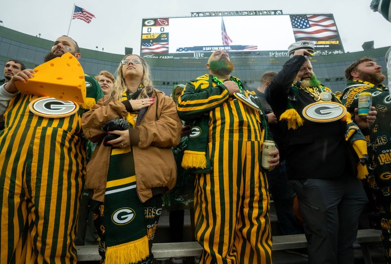 Fans stand for the National Anthem before the Green Bay Packers game against the Arizona Cardinals.