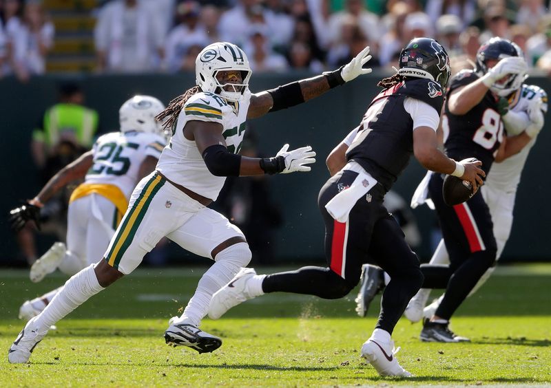 Green Bay Packers defensive end Rashan Gary (52) chases Houston Texans quarterback C.J. Stroud (7) on Sunday, October 20, 2024 at Lambeau Field in Green Bay, Wis. 
Wm. Glasheen USA TODAY NETWORK-Wisconsin