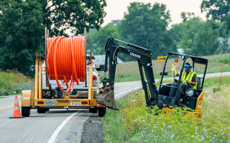 Five Star Energy Services underground utility construction worker uses an excavator to clear debris and prepare the installation of the underground fiber optic cable on Wednesday, August 3, 2022 in Ripon, Wis.



Jovanny Hernandez / Milwaukee Journal Sentinel