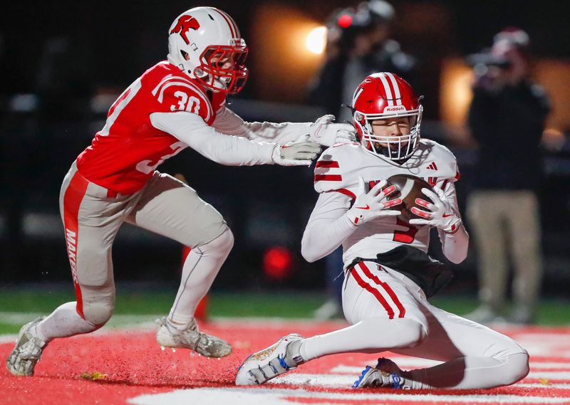 Neenah's Ashton Van Beek catches a touchdown pass against Kimberly in a WIAA Division 1 second-round playoff game at Papermaker Stadium on Nov. 1, 2024. Van Beek will play quarterback this season for the Rockets.