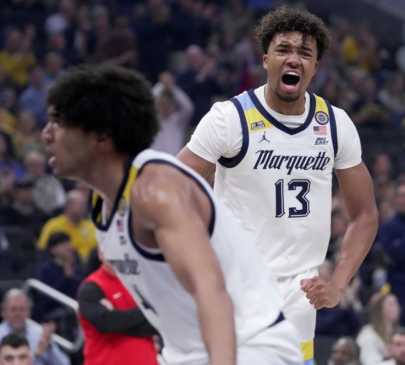 Marquette's Royce Parham (13) reacts after a dunk during the first half of their game against Stony Brook Monday, November 4, 2024 at Fiserv Forum in Milwaukee, Wisconsin.