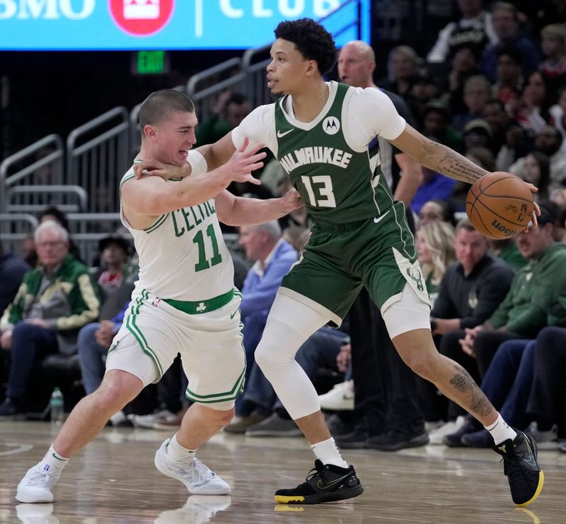 Boston Celtics guard Payton Pritchard (11) guards Milwaukee Bucks guard Ryan Rollins (13) during the first half of their game Sunday, November 10, 2024 at Fiserv Forum in Milwaukee, Wisconsin.