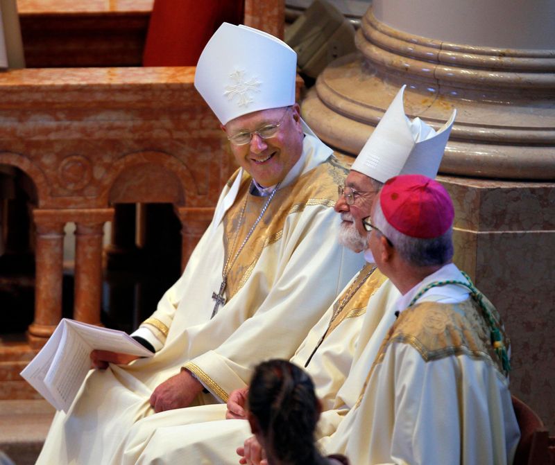 New York Archbishop Timothy Dolan (left) shares a lighter moment with Bishop Richard Sklba (center) and Bishop-elect Father Donald Hying during the ordination Mass for Bishop-elect Father Donald Hying, who became the next auxillary bishop of the archdiocese of Milwaukee in 2011.