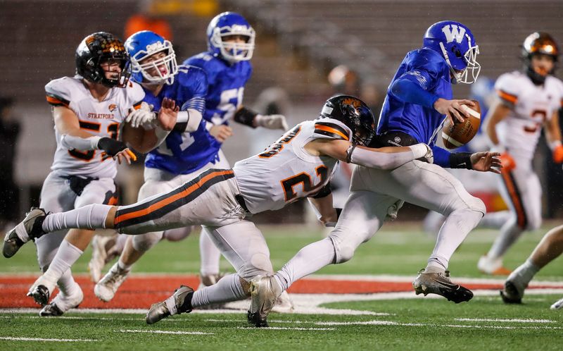 Stratford High School's Xander Curtice (28) sacks Wrightstown High School's Trevor Vande Hey (6) during the WIAA Division 5 state championship game on Thursday, November 21, 2024, at Camp Randall Stadium in Madison, Wis. 
Tork Mason/USA TODAY NETWORK-Wisconsin