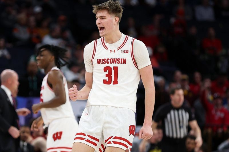 Mar 14, 2024; Minneapolis, MN, USA; Wisconsin Badgers forward Nolan Winter (31) celebrates his basket against the Maryland Terrapins during the first half at Target Center. Mandatory Credit: Matt Krohn-Imagn Images
