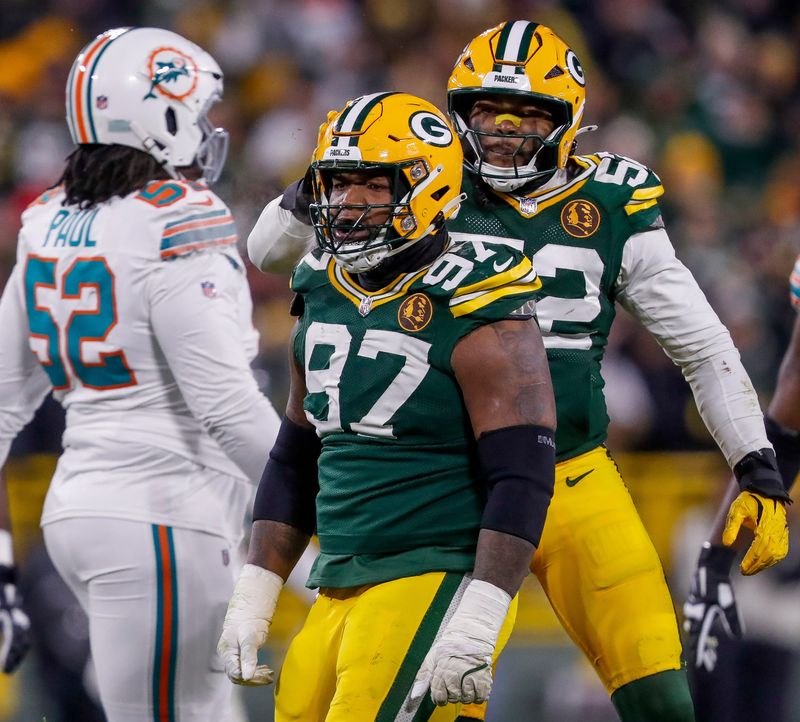 Green Bay Packers defensive tackle Kenny Clark (97) and defensive end Rashan Gary (52) celebrate after Clark sacks Miami Dolphins quarterback Tua Tagovailoa on Thursday, November 28, 2024, at Lambeau Field in Green Bay, Wis. The Packers won the game, 30-17.
Tork Mason/USA TODAY NETWORK-Wisconsin