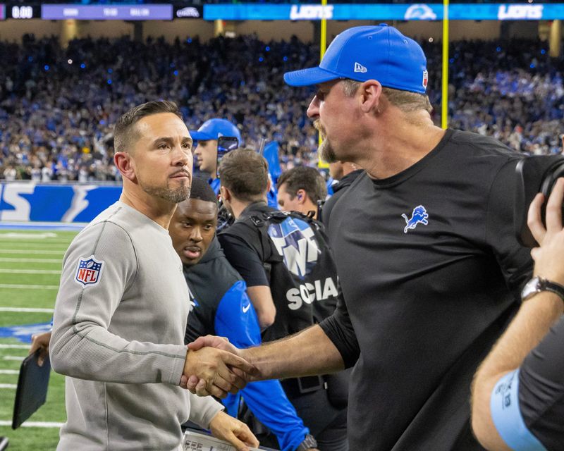 Dec 5, 2024; Detroit, Michigan, USA; Green Bay Packer Head Coach Matt LaFleur (L) shakes hands with Detroit Lions Head Coach Dan Campbell after the game at Ford Field. Mandatory Credit: David Reginek-Imagn Images