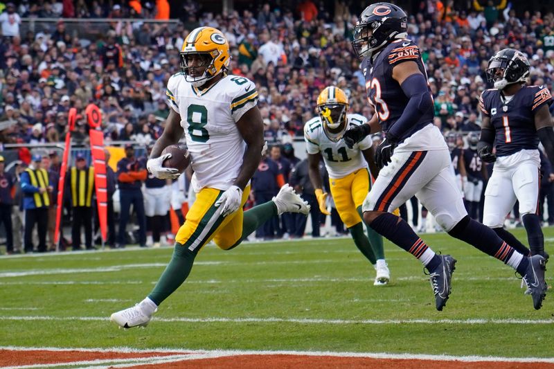 Green Bay Packers running back Josh Jacobs (8) runs for a touchdown against the Chicago Bears during the second half on Nov. 17, 2024, at Soldier Field in Chicago.