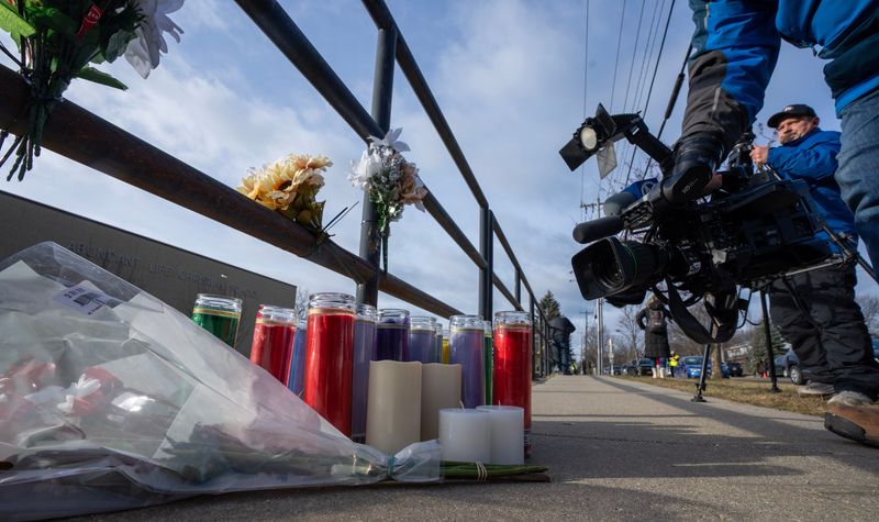 Media gather outside the Abundant Life Christian School on Tuesday, December 17, 2024, in Madison, Wisconsin.