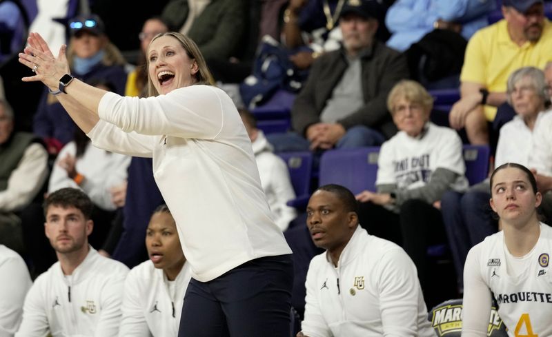 Marquette women’s basketball coach Cara Consuegra is shown during the first half of their game against UConn Wednesday, January 1, 2025 at the Al McGuire Center in Milwaukee, Wisconsin.