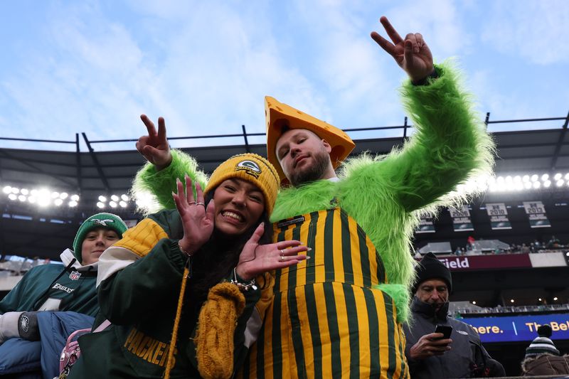 Jan 12, 2025; Philadelphia, Pennsylvania, USA; Green Bay Packers fans react during the game against the Philadelphia Eagles in an NFC wild card game at Lincoln Financial Field. Mandatory Credit: Bill Streicher-Imagn Images