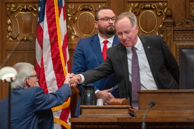 Gov. Tony Evers, left, and Assembly Speaker Robin Vos shake hands before the governor’s State of the State address Wednesday, January 22, 2025 at the Capitol in Madison, Wisconsin. Evers focused on measures his administration and state lawmakers have taken to lower taxes and blunt the effects of inflation and plans to announce a $300 million proposal to address mental health in children.