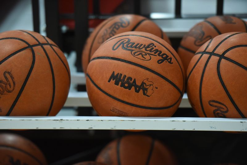 Basketballs sit on a rack in the gymnasium at St. Clair High School on Wednesday, Jan. 29, 2025.