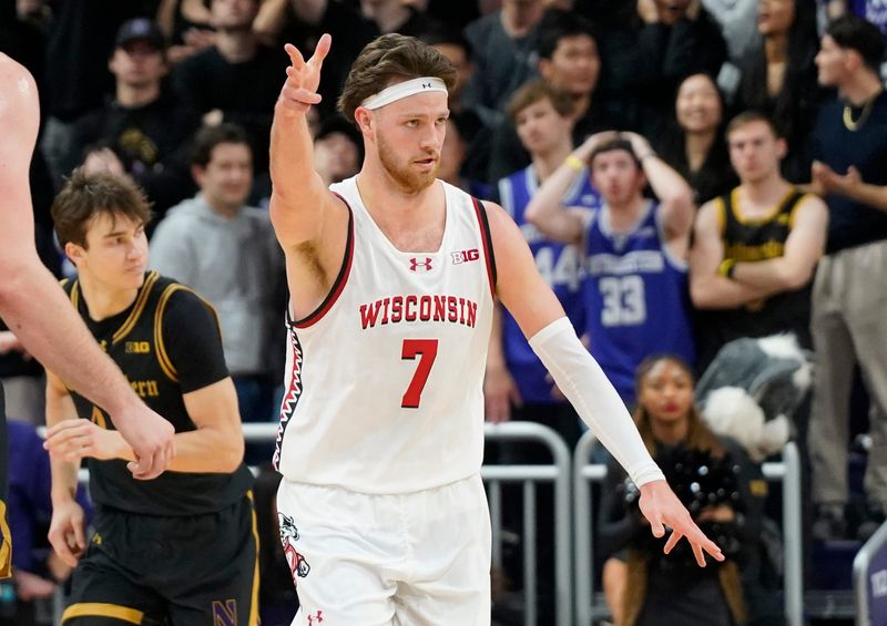 Feb 1, 2025; Evanston, Illinois, USA; Wisconsin Badgers forward Carter Gilmore (7) gestures after a three point basket against the Northwestern Wildcats during the second half at Welsh-Ryan Arena. Mandatory Credit: David Banks-Imagn Images