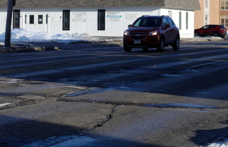 Road damage on Shawano Avenue near Green Bay West High School pictured on Feb. 6, 2025, in Green Bay, Wis.