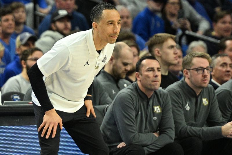 Feb 8, 2025; Omaha, Nebraska, USA; Marquette Golden Eagles head coach Shaka Smart watches action against the Creighton Bluejays in the first half at CHI Health Center Omaha. Mandatory Credit: Steven Branscombe-Imagn Images