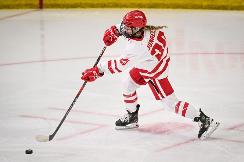 Wisconsin Badgers defender Vivian Jungels (20) fires a shot for a goal against the Minnesota Gophers in the second period of a game Sunday, February 9, 2025, at LaBahn Arena in Madison, Wisconsin.