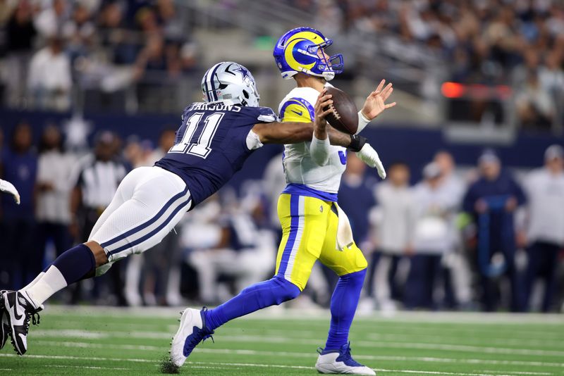Oct 29, 2023; Arlington, Texas, USA; Dallas Cowboys linebacker Micah Parsons (11) attempts to sack Los Angeles Rams quarterback Matthew Stafford (9) in the second quarter at AT&T Stadium. Mandatory Credit: Tim Heitman-USA TODAY Sports